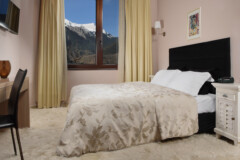 karpenisi-forest-suites-deluxe-room-bedroom