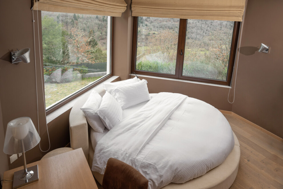 karpenisi-forest-suites-honeymoon-suite-bedroom-winter-garden-view